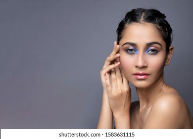 Closeup Portrait Of An Indian Model With Bold Eye Makeup And Lipstick Looking At Camera. Makeup Portrait For Eye Makeup And Lipstick.