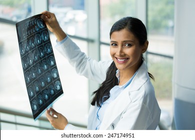 Closeup Portrait Of Intellectual Woman Healthcare Personnel With White Labcoat, Looking At Full Body X-ray Radiographic Image, Ct Scan, Mri, Isolated Hospital Clinic Background. Radiology Department