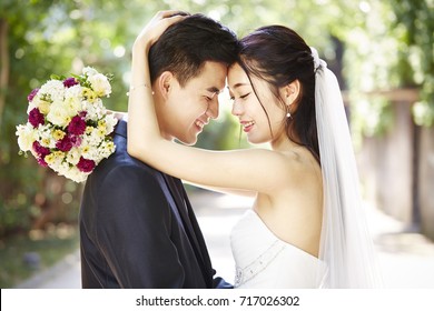 Close-up Portrait Of Intimate Wedding Couple.