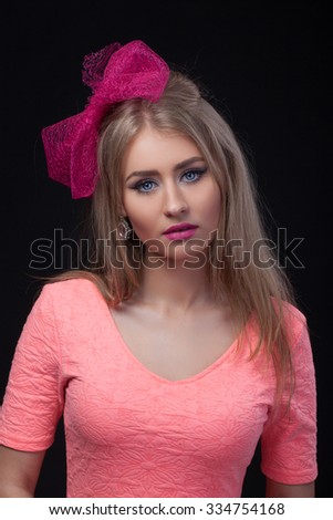 Close-up portrait, isolated, Blonde model with pink bow