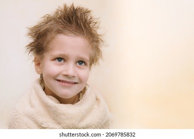 Close-up Portrait Of Joyful Cute Caucasian Little Boy Not Looking At Camera, Smiling, Wrapped In Orange Towel With Wet Hair. Horizontal Shot With Copy Space. Easy Children Washing Concept