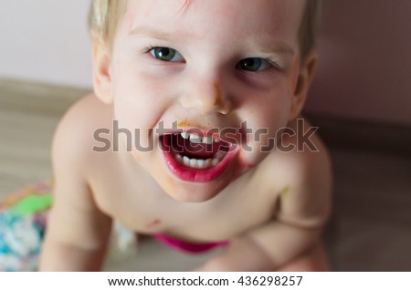 Similar – Happy adorable infant baby boy child smiling while eating two frozen fruit popsicle ice creams in simmer.