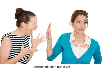 Closeup Portrait, Mad Woman Nagging Complaining To Other Lady Who Is Getting Pissed Off Annoyed, Isolated White Background. Negative Human Emotion Facial Expression Feelings. Interpersonal Conflict