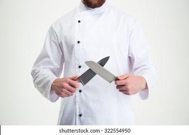 Closeup Portrait Of A Male Chef Cook Sharpening Knife Isolated On A White Background