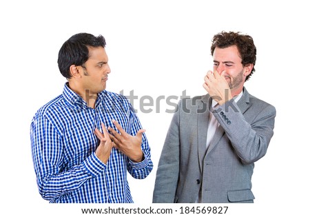 Closeup portrait, man looking at guy closing, covering nose, something stinks, very bad smell, odor. Male asks me? Isolated white background. Negative human emotion, facial expression, feeling