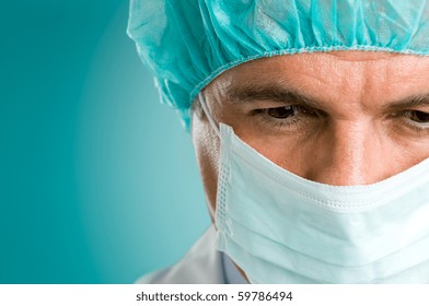 Closeup Portrait Of A Mature Male Surgeon In The Operating Room, Space For Text