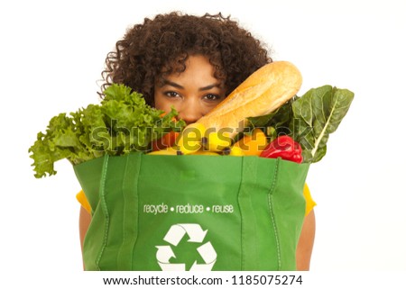 Closeup portrait of millennial black woman carrying big bag of groceries Photo stock © 