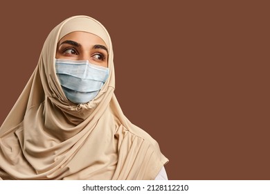 Close-up Portrait Of A Muslim Woman In A Mask. The Concept Of Medicine, Health Care.