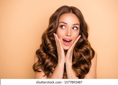 Close-up portrait of nice attractive lovely feminine sensual gorgeous cheerful cheery girlish wavy-haired girl enjoying expecting sale give away isolated on beige pastel color background