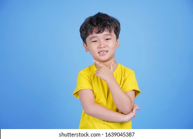Close-up portrait of a nice attractive trendy cheerful cheery Korean little boy pointing up recommend decision solution isolated over bright vivid shine vibrant blue color background - Shutterstock ID 1639045387