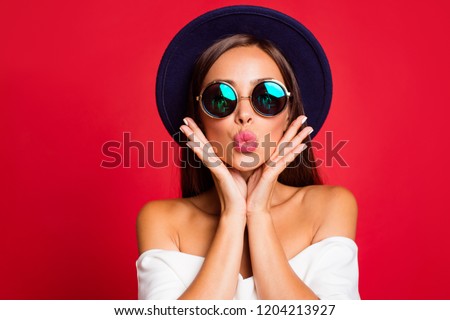 Close-up portrait of nice cool bright vivid attractive sweet lovely positive lady wearing white off-the-shoulders ruffles top blouse sending kiss holding cheeks in palms isolated over red background