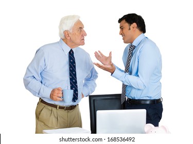 Closeup Portrait Of Old Elderly Business Man Boss, Checking On His Young Employee, Pushing To Work Hard On Project, Who Is In Disagreement Unhappy, Isolated On White Background. Conflict At Work Place