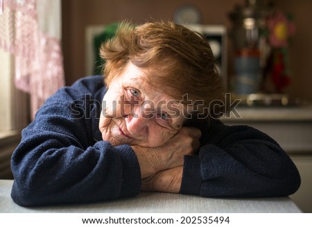 Similar – Image, Stock Photo Senior woman in a wheelchair alone in a room