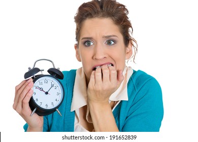 Closeup Portrait, Overwhelmed, Busy, Unhappy Stressed Female, Anxious Funny Looking Woman, Student Biting Finger Nails, Running Out Of Time, Holding Alarm Clock Exhausted, Isolated White Background.