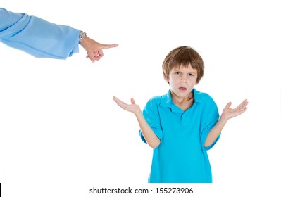 Closeup Portrait Of Parent Pointing At Child To Go To Room For Misbehaving While Kid Asks What Did I Do? Isolated On White Background.