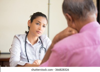 Closeup portrait, patient talking serious conversation to healthcare professional, isolated indoors background