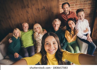 Closeup Portrait Photo Of Big Full Family Eight People Gathering Cuddle Embrace Small Girl Daughter Make Selfie Beaming Smile Sitting Sofa Generation In Home Evening Living Room Indoors