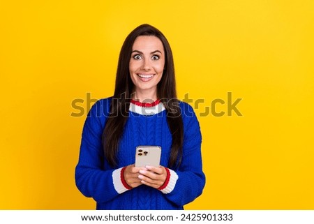 Closeup portrait photo of cheerful young woman surprise with new apple iphone 15 pro max features isolated on yellow color background