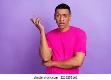 Closeup portrait photo of young boss student wear bright neon t-shirt eyebrow up misunderstanding hand up irritated isolated on purple color background - Shutterstock ID 2216252161
