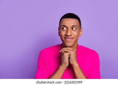 Closeup portrait photo of young dreamy guy hands together glad looking interested information satisfied wish gift isolated on purple color background - Shutterstock ID 2216201999