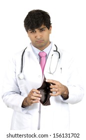 Closeup Portrait Of Poor, Broke Doctor Showing He Has No Money In His Wallet, Isolated On White Background. Health Care Reform, Medicaid Reimbursement. Obamacare Plan Government Debate.