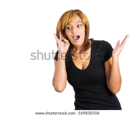 Closeup portrait of pretty young nosy woman trying to secretly listen in on a conversation, hand to ear surprised shocked at juicy gossip she hears, privacy violation, isolated on white background