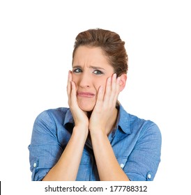 Closeup portrait of a pretty young woman looking disgusted in disbelief with hands on face, isolated on white background. Negative human emotions facial expression feelings, attitude, reaction