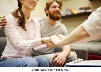 Closeup Portrait Of Psychiatrist Supporting Young Family At Couples Counseling