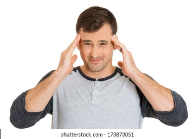 Closeup Portrait Of Really Stressed Out Young Man, Handsome Student With Headache, Having Bad Day At Work, School, University, Isolated On White Background. Negative Human Emotions, Facial Expressions