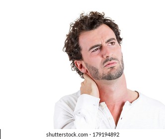 Closeup portrait of really stressed scowling business man , funny looking guy with bad tight sprained muscle neck pain, isolated on white background. Negative human emotions, facial expressions