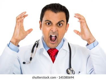 A close-up portrait of a rude, frustrated, upset doctor isolated on a white background 