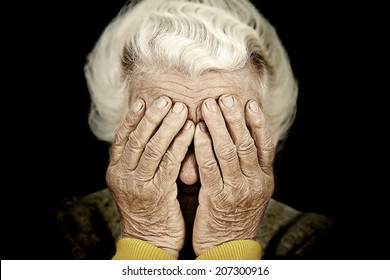 Closeup Portrait Sad Depressed, Stressed, Thoughtful, Senior, Old Woman, Gloomy, Worried, Covering Her Face, Isolated Black Background. Human Face Expressions, Emotion, Feelings, Reaction, Attitude