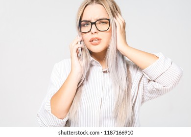 Closeup Portrait, Sad, Depressed, Unhappy Worried Young Woman Talking On Phone, Isolated Over White Background. Negative Human Emotions, Facial Expressions, Feelings. Bad News.