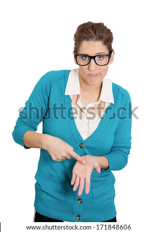 Closeup portrait of sad young woman with finger to hand sign motioning feeling guilty, sorry for the actions faults she has done wrong, isolated on white background. Human facial expressions, emotions