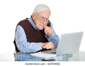 Closeup portrait of senior elderly mature man with glasses biting finger nails trying to type on laptop, isolated on white background. Human emotions and facial expressions. Age related changes.