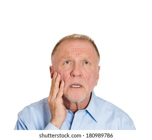 Closeup Portrait Of Senior Elderly Mature Depressed Man Really Sad, Deep In Thought, Looking Up Asking Question Why Me? Isolated On White Background. Human Face Expressions, Emotion, Feeling, Reaction