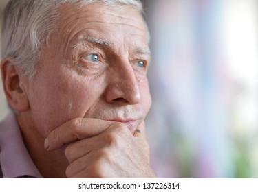 close-up portrait of a senior man thinking about something - Powered by Shutterstock