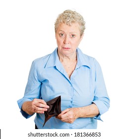 Closeup Portrait Of Senior Mature Cute, Surprised, Unhappy, Puzzled Woman, Shocked Lady Holding Empty Wallet, Isolated On White Background. Negative Human Emotions, Facial Expressions, Reaction