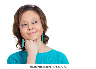 Closeup portrait of senior mature woman with face on hand daydreaming deeply about something, isolated on white background. Positive emotion facial expression feelings, attitude, reaction, situation