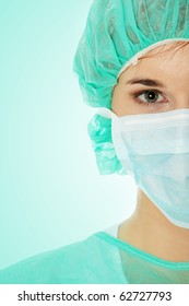 Close-up Portrait Of Serious Nurse Or Doctor In White Mask