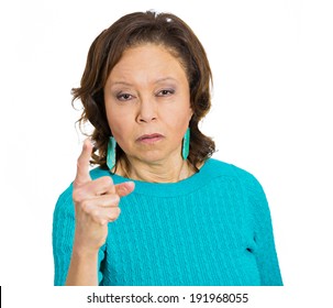 Closeup Portrait Serious, Skeptical, Mad Angry Pissed Off Woman Pointing Index Finger At You Placing Blame, Accusation, Isolated White Background. Negative Emotion, Facial Expression, Feeling Reaction