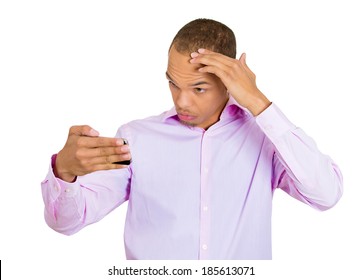 Closeup Portrait, Shocked Man Feeling Head, Surprised He Is Losing Hair, Receding Hairline Or Seeing Bad News On Cellphone, Isolated White Background. Negative Facial Expressions, Emotion Feeling