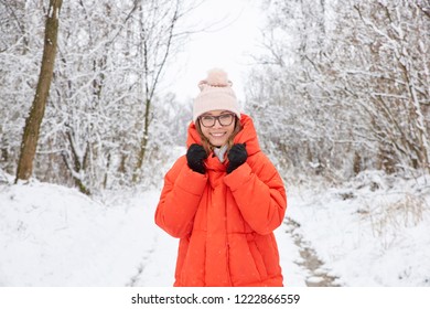 Close-up Portrait Shot Of A Happy Middle Aged Woman Wearing Hat While Standing Outdoor And Enjoy Winter Weather. 