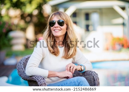 Similar – Image, Stock Photo Casual woman in sunglasses leaning against a brick wall