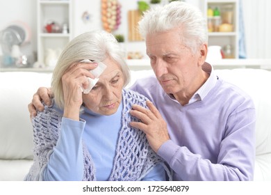 Close-up Portrait Of Sick Elderly Woman And Man At Home