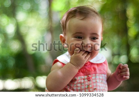 Six months old baby girl outdoors