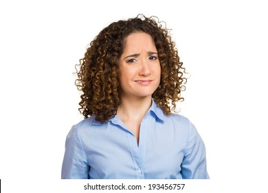 Closeup Portrait Skeptical, Upset Young Woman Looking Suspicious, Disgust On Face, Mixed Disapproval, Judgement Isolated White Background. Negative Human Emotion, Facial Expression, Feeling, Attitude
