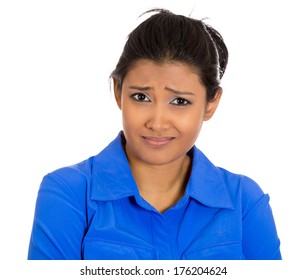Closeup portrait of skeptical young woman looking suspicious with some disgust on her face, mixed with disapproval, isolated on white background. Negative human emotions, facial expressions, feelings