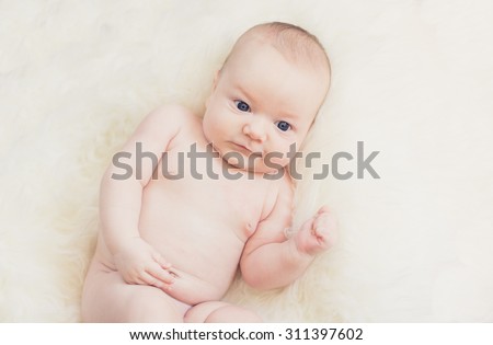 Similar – Baby girl four months old having her bath