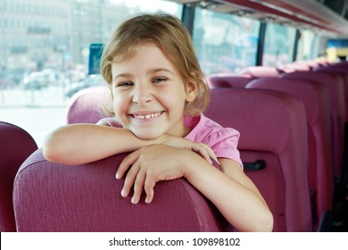 Closeup portrait of smiling girl on bus seat
